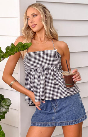 Black gingham halter top with bow detailing and tie up back, styled with a denim mini skirt