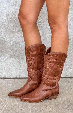 model wearing tan PU leather cowboy boots