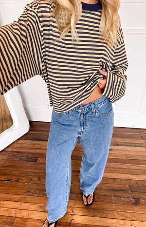 girl wearing baggy dad jeans in a mid wash